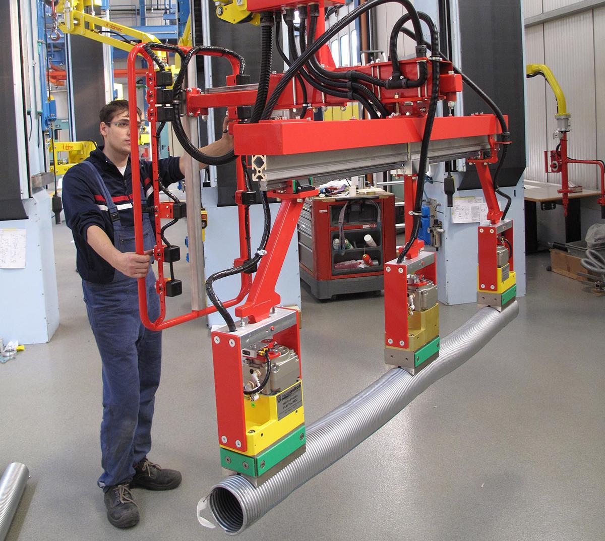 Assen en buizen ergonomisch tillen met pneumatische tilhulp